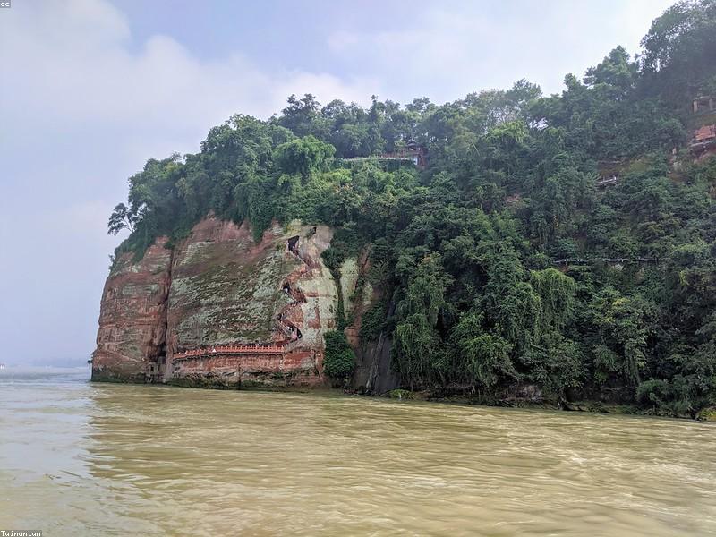 Hat on Leshan Boat — Sun Reflects Off Water Hard